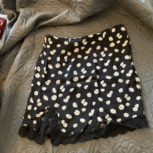 cute lace trimmed daisy skirt with slit.